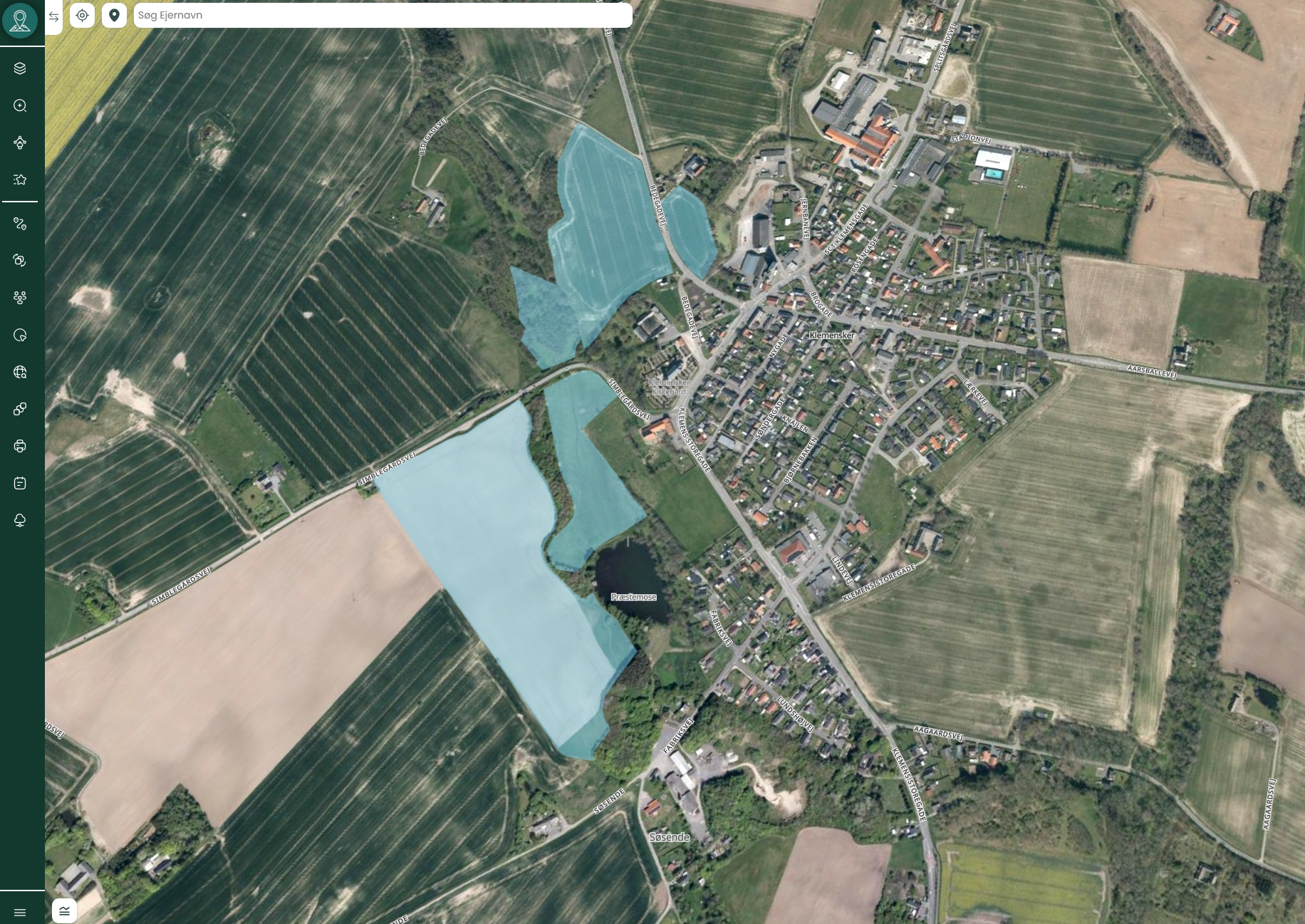 Marker ejet af Folkekirken – Kortdata og Analyse i MapIt | Viamap 1 Kortvisning i MapIt med fremhævede marker ejet af folkekirken nær en dansk landsby.